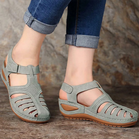 Stylish women's white cutout flat sandals, perfect for spring and summer casual walking