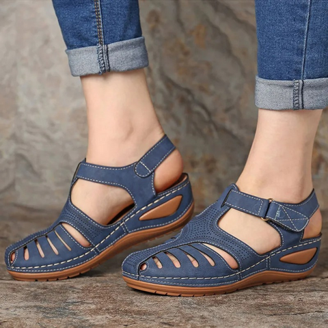Close-up of women's blue cutout walking sandal, highlighting comfortable design and open toe