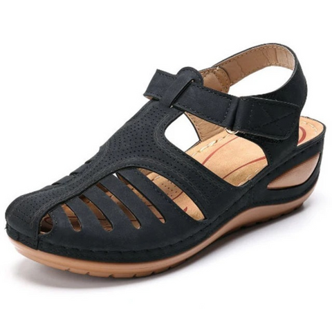 Pair of womens grey cutout walking sandals, versatile and comfortable for spring outings