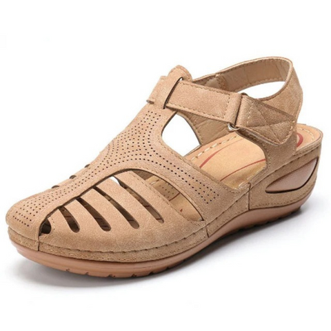 Front view of women's beige cutout flat walking sandals, great for comfortable spring footwear
