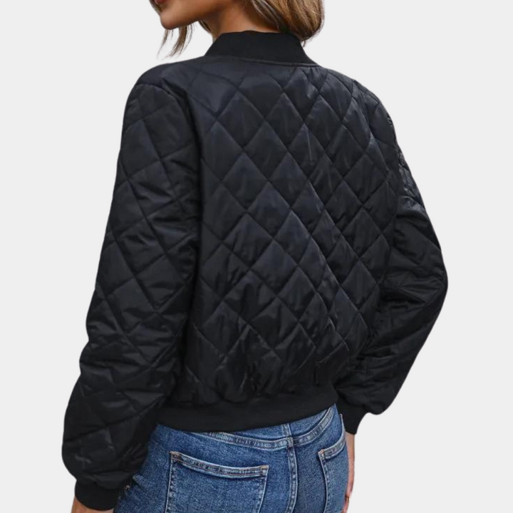 Stylish women's puffer bomber jacket. Full-zip design for urban casual wear in autumn and winter. Cozy, versatile outerwear.
