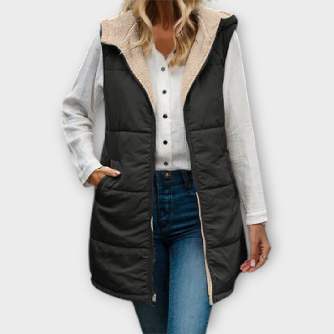 Front view of a women's cream puffer vest with fleece lining, a versatile addition to winter fashion.