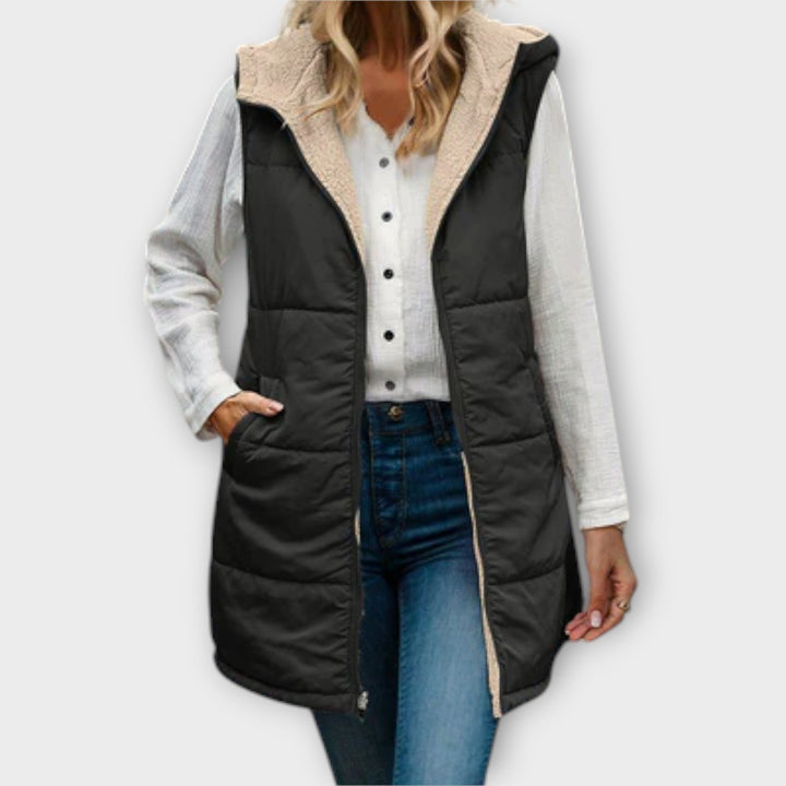 Front view of a women's cream puffer vest with fleece lining, a versatile addition to winter fashion.