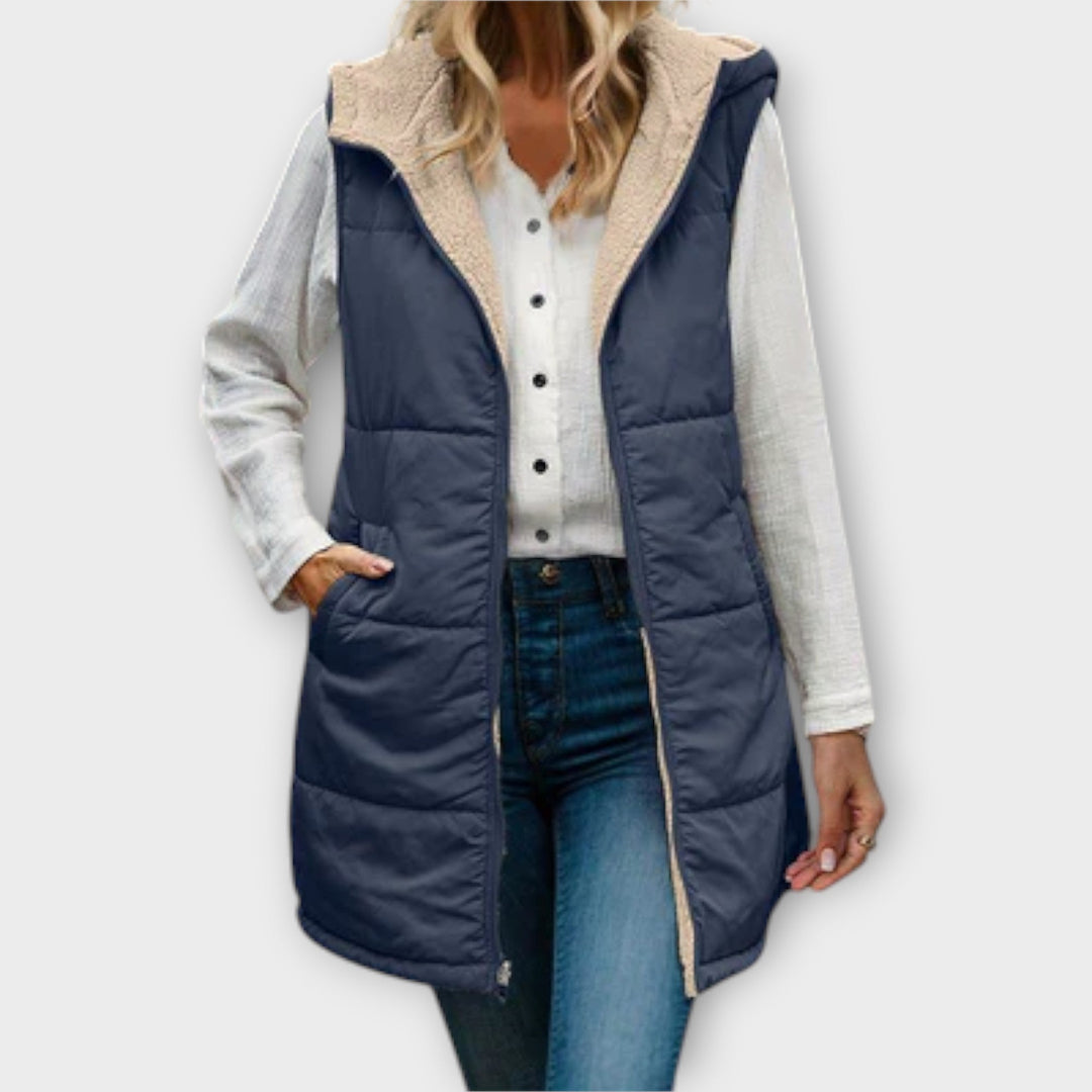 Close-up of the quilted detail and fleece lining of a women's insulated puffer vest, comfortable outdoor vest.
