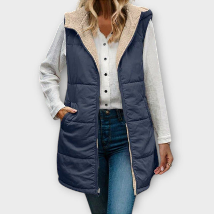 Close-up of the quilted detail and fleece lining of a women's insulated puffer vest, comfortable outdoor vest.