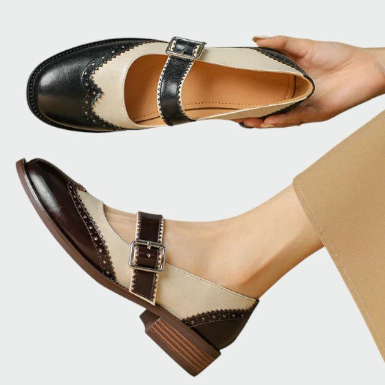 Front view of women's leather Mary Jane block heel shoes, showcasing the stylish strap design