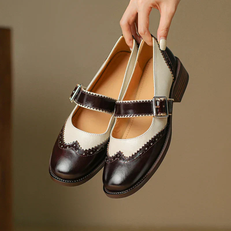 Close-up of women's casual leather Mary Jane shoe detailing the adjustable strap and comfortable flat sole.