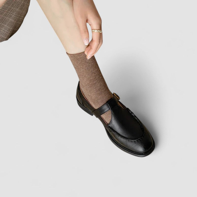 Pair of women's comfortable black leather orthopedic Mary Jane shoes with square toe, low heel