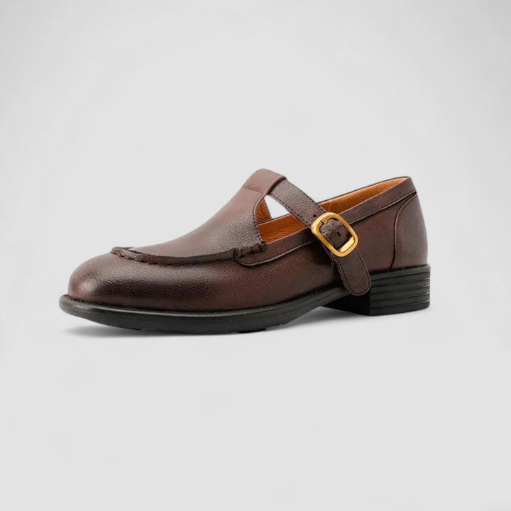 Side profile of a women's black leather orthopedic Mary Jane shoe with a distinct square toe
