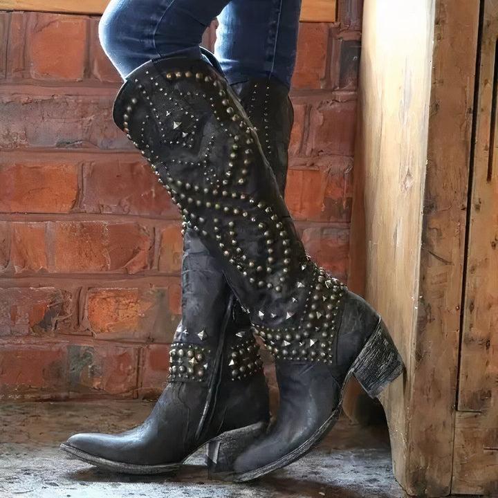 Women's black leather studded knee-high western boots with block heel and pointed toe, perfect for autumn fashion