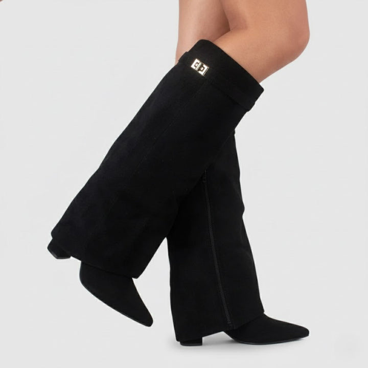 Women's black leather thigh-high boots with elegant buckle detail and pointed toe.