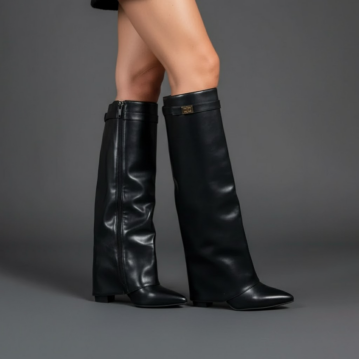 Side profile of women's black leather thigh-high boots, emphasizing the buckle design.