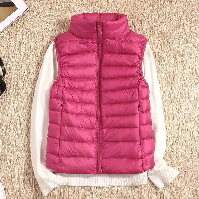 Variety of women's packable puffer vests in different colors, showcasing options for casual wear.