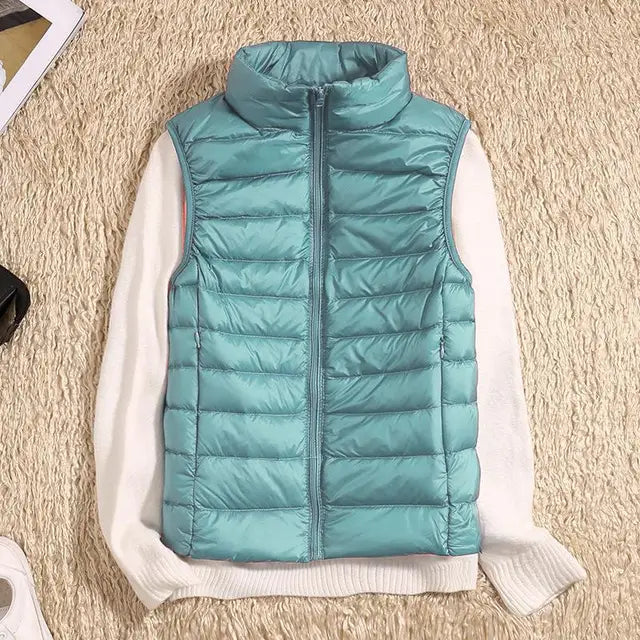 Close-up of a stylish women's lightweight puffer vest in red, perfect for casual layering.