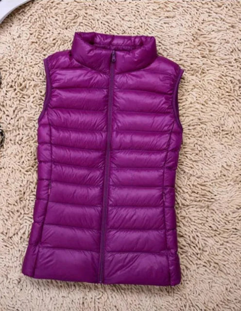 Detail of the zipper and quilted pattern on a women's lightweight puffer vest.