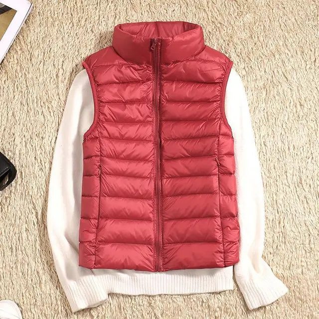 Women's vibrant green packable puffer vest, adding a pop of color to winter fashion.