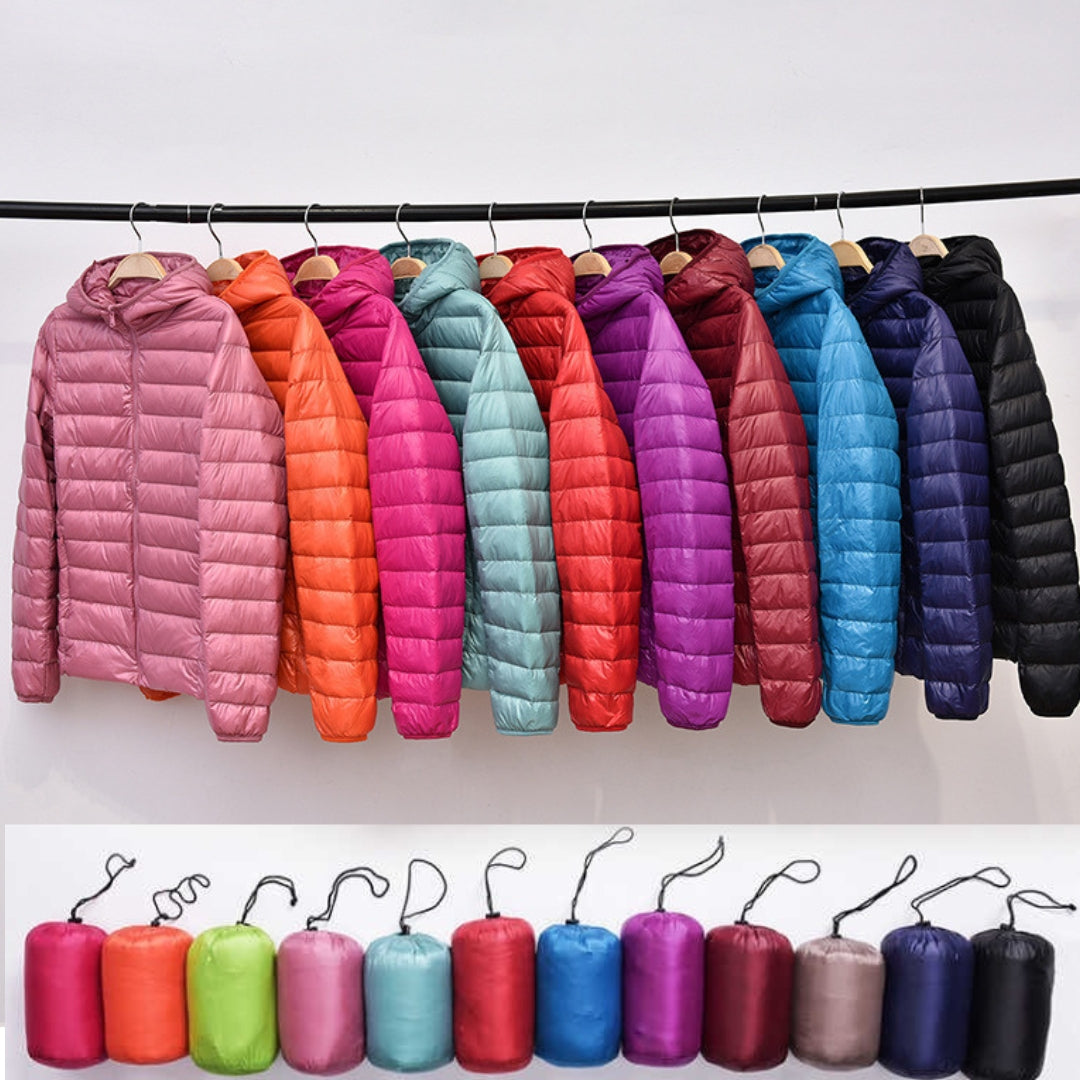 Women's black lightweight waterproof down jacket, ideal for winter outdoor wear and travel.