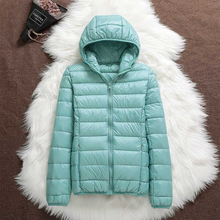 Multicolor women's down jackets, showcasing variety in waterproof and lightweight designs.