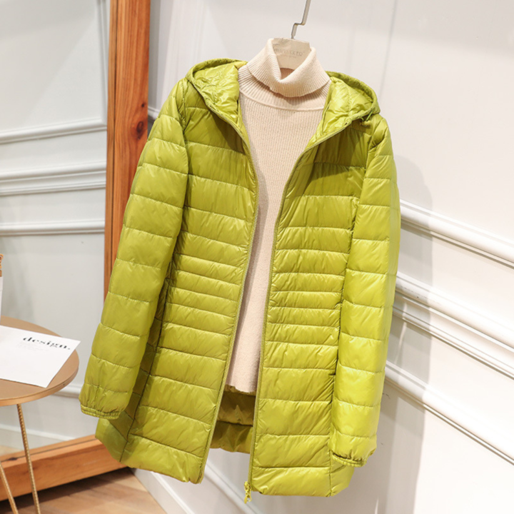Chic woman in a lightweight black down jacket, perfect for city and nature, warm and stylish.