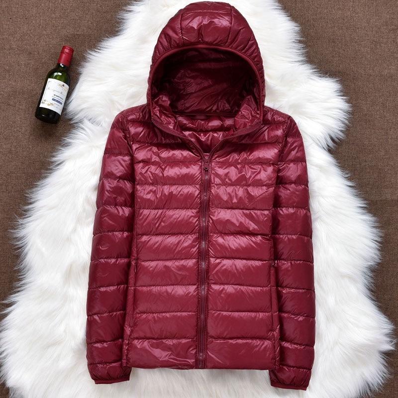 Back view of a women's lightweight down jacket, highlighting its comfortable fit and practicality.