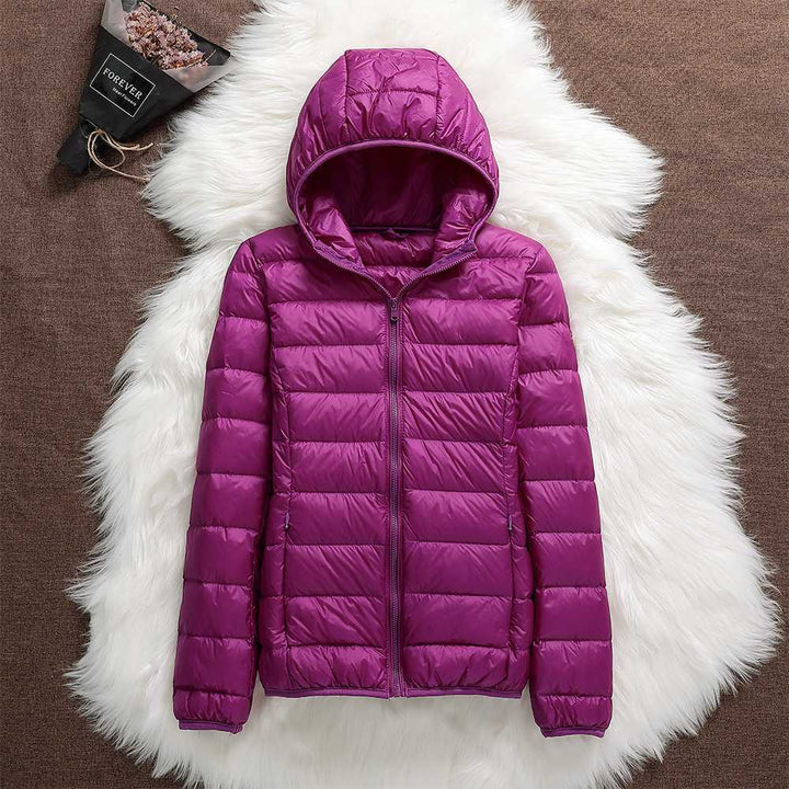 Women's waterproof winter coat in cream, a warm and elegant choice for cold climates.