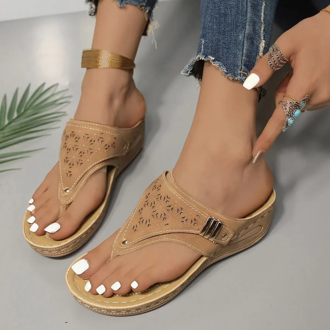 Casual women's black platform sandals featuring a comfortable footbed and modern cut-out style.