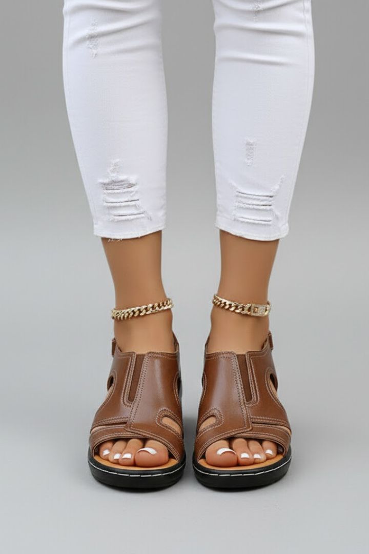 Stylish women's platform open-toe sandals with intricate cutouts, comfortable design