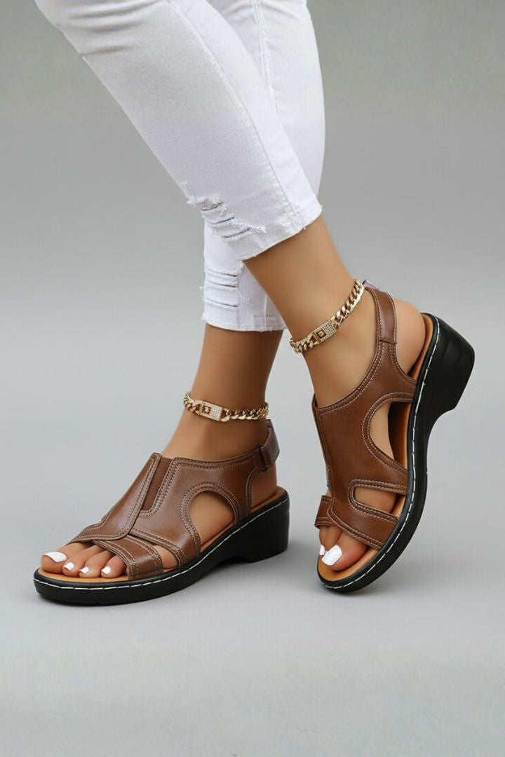 Close-up of women's open-toe platform sandals showing unique cutout pattern
