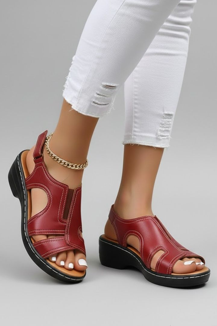 Pair of women's open-toe platform sandals displaying comfortable sole and chic cutouts