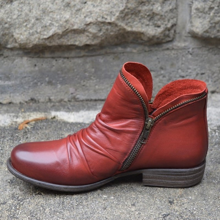 Comfortable versatile women's winter boots. Ruched leather ankle boots with side zipper.