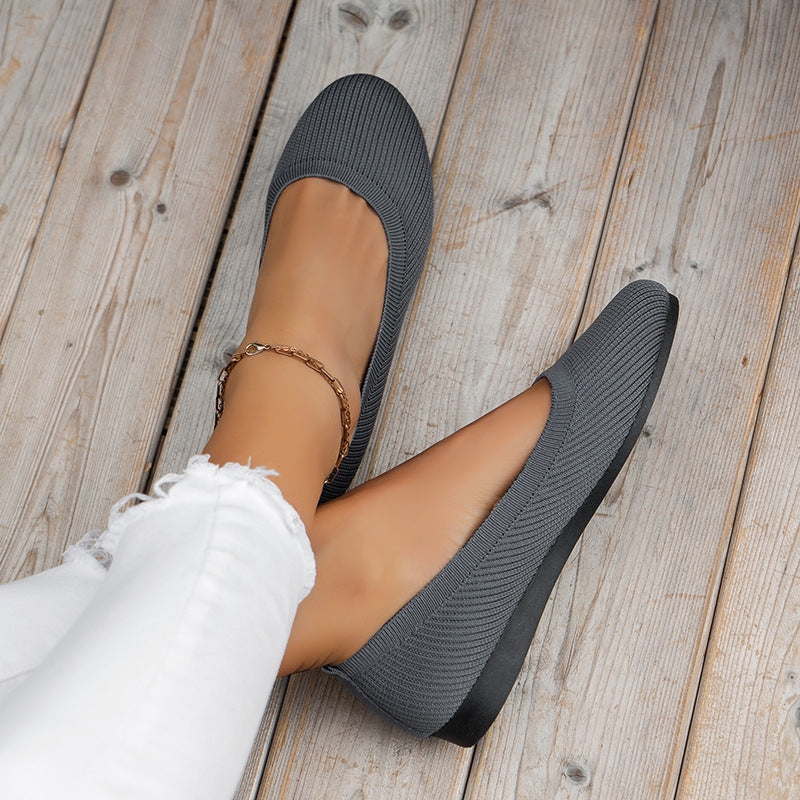 Women's black slip-on orthopedic shoes for all-day comfort & support, lightweight & breathable.