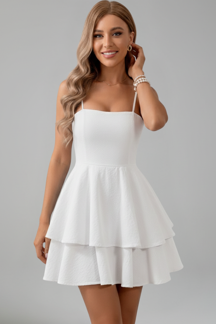Back view of women's spaghetti strap flared mini dress, highlighting the back design