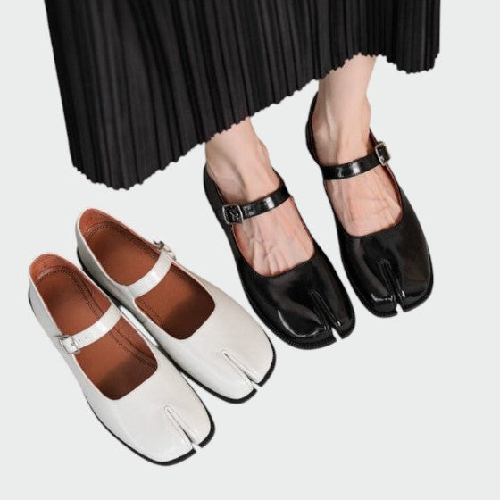 Women's black split-toe Mary Jane shoes with a stylish block heel and buckle closure, front view.