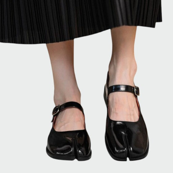 Close-up of the buckle detail on women's split-toe Mary Jane shoes, highlighting craftsmanship.