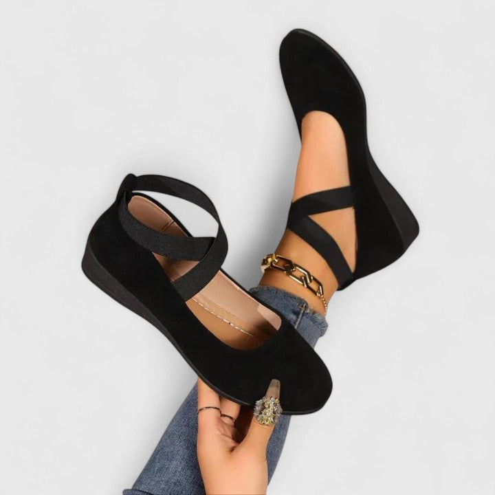 Women's black strappy round-toe wedge flats, perfect comfortable summer footwear for everyday wear.