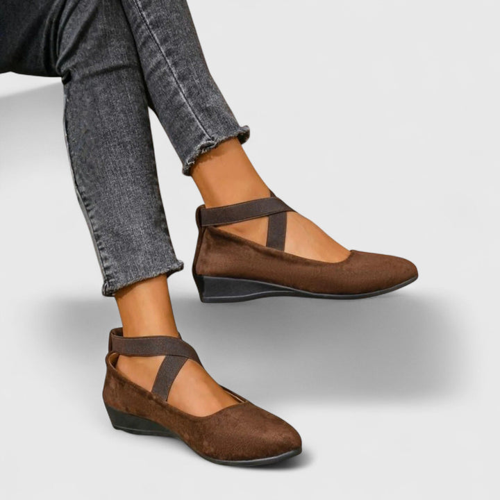 Close-up of a women's strappy round-toe wedge flat, showcasing the detailing of these summer comfort shoes.