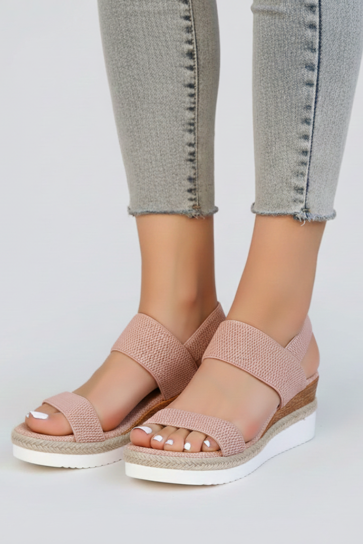Stylish women's fashion sandals with a raised sole and open-toe, perfect for summer outfits.