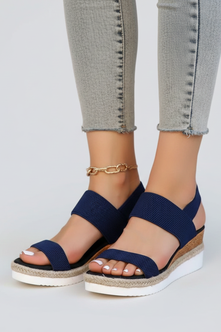 Comfortable women's stretch fit sandals with a durable raised sole for all-day wear.