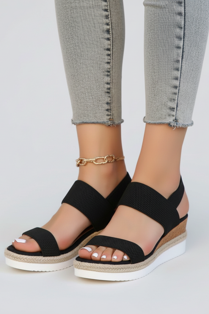Women's raised sole casual sandals featuring a flexible stretch fit for easy slip-on comfort.