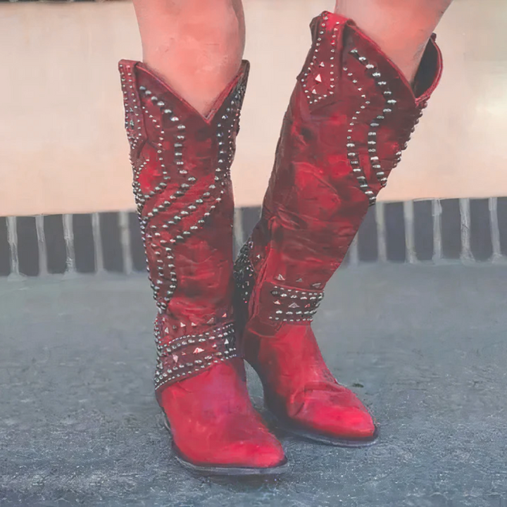 Fashionable women's Western boots with studded patterns, suitable for a striking festival or summer shoe look.