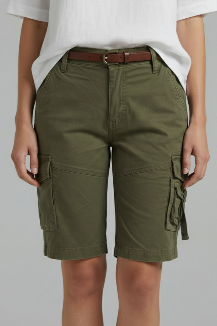 Close-up of women's denim cargo shorts with a visible utility pocket and button closure.