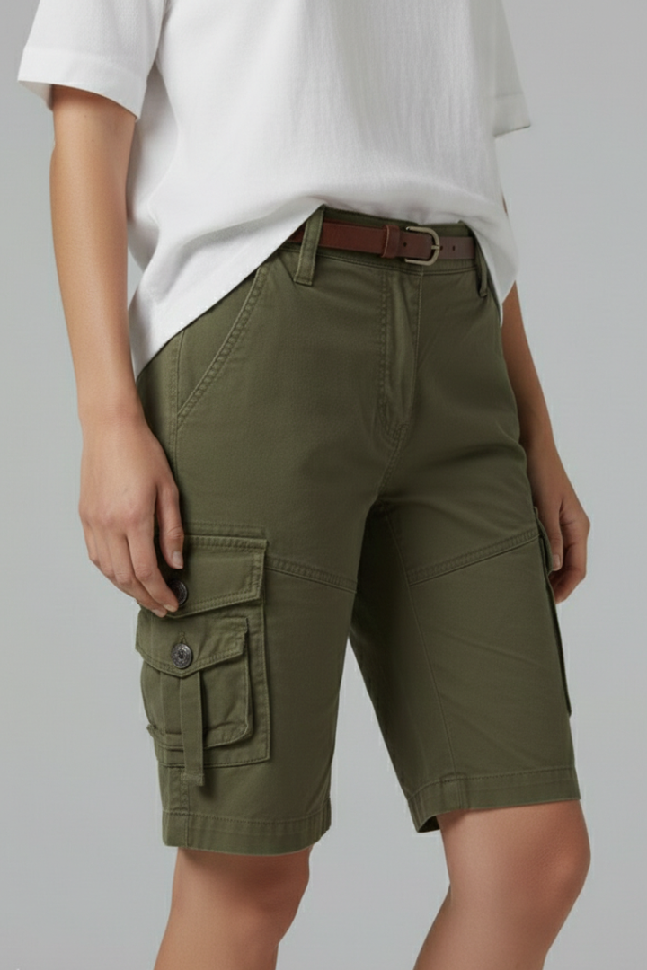 Model wearing women's green utility cargo shorts, highlighting their casual fit and pocket details.