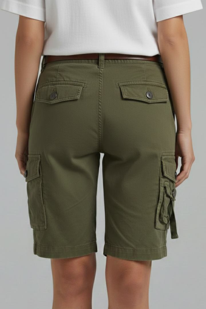 Stack of folded women's utility pocket cargo shorts in various colors: black, khaki, and navy.