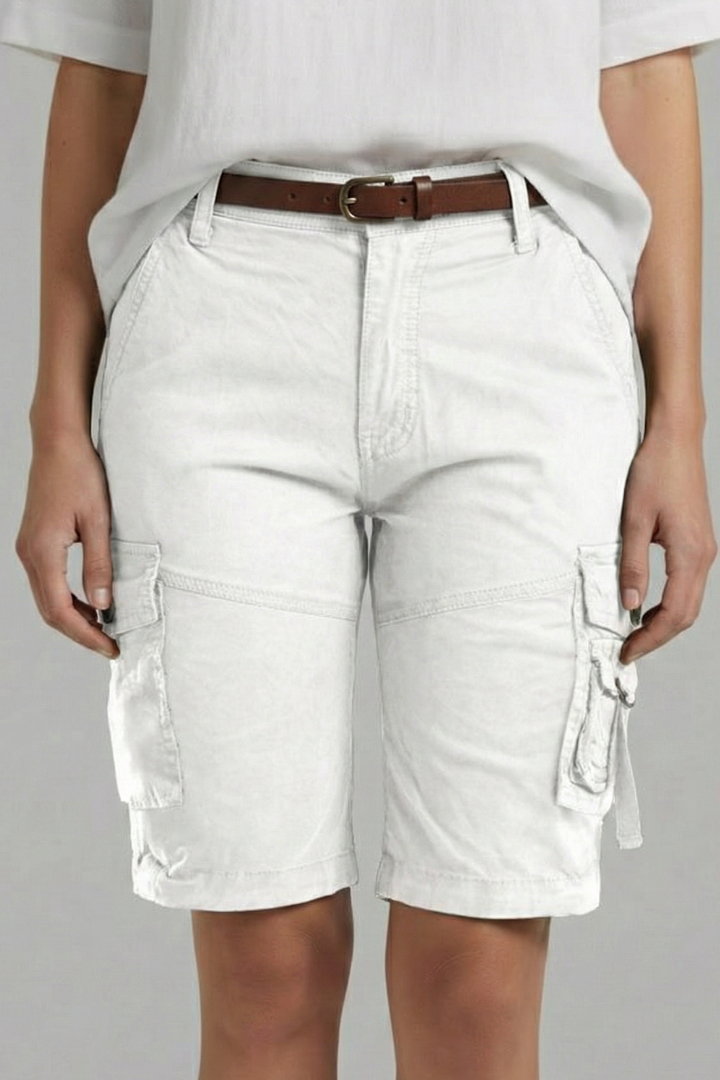 Detail shot of a sturdy utility pocket on women's cargo shorts, showcasing stitching and button.
