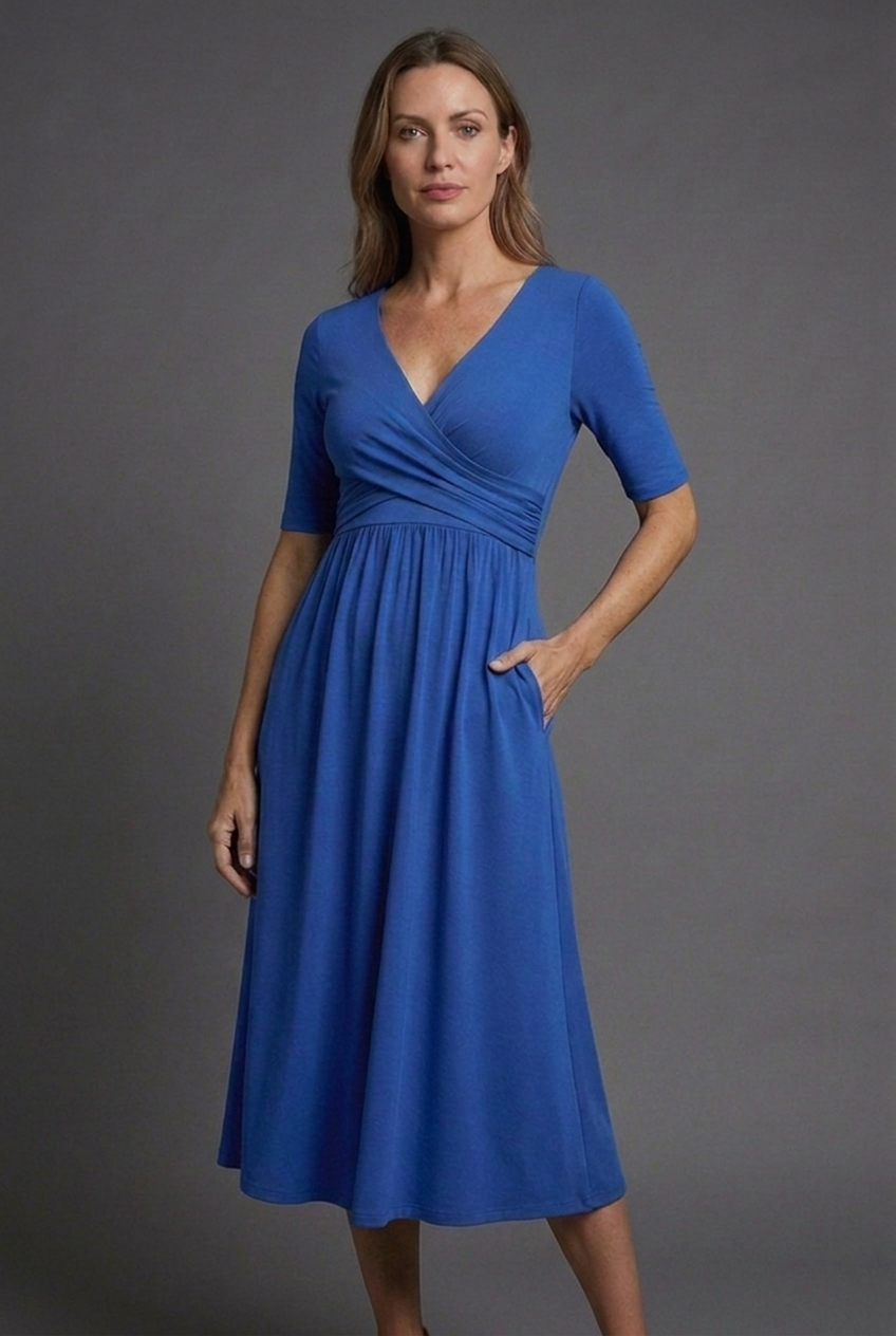 Flattering black V-neck wrap midi dress for women with short sleeves & convenient pockets, ideal for summer style.
