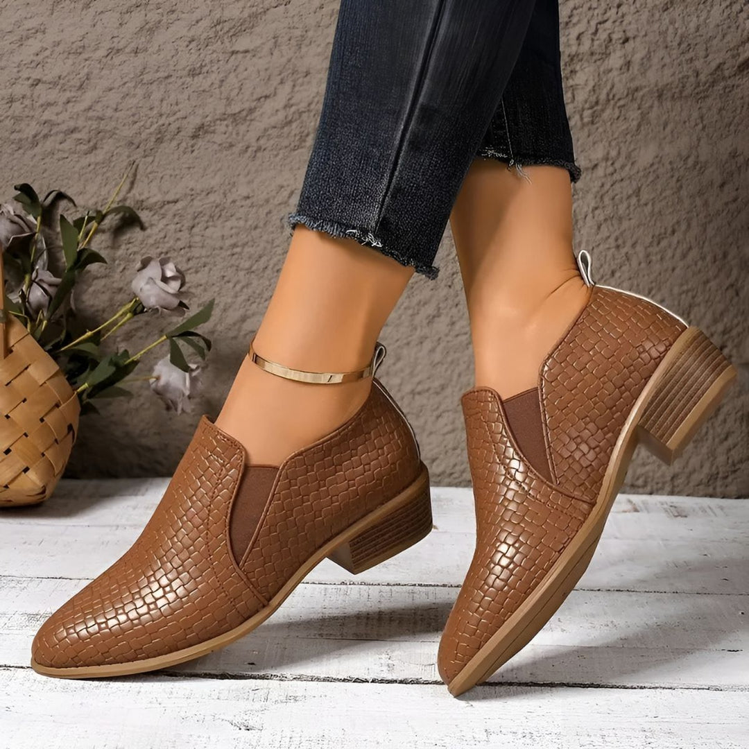 Women's formal black oxford shoes made from durable vegan leather, designed for comfort and style.