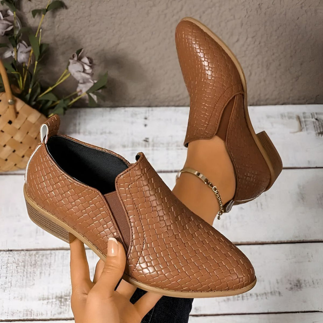 Top-down view of black vegan leather oxford shoes for women, a comfortable and stylish wardrobe staple.