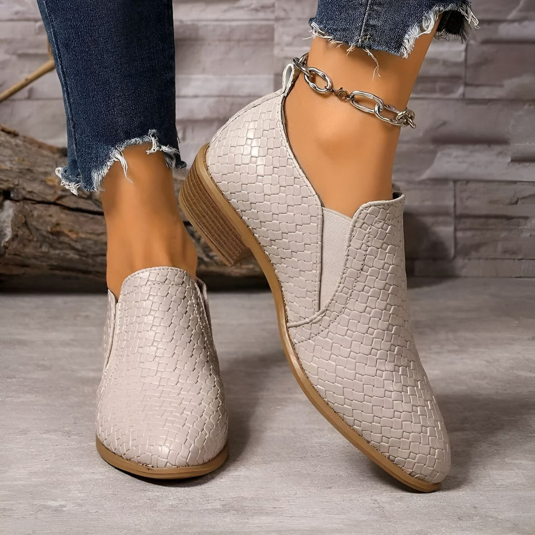 Elegant black vegan leather oxford shoes for women, providing comfort for all-day wear.