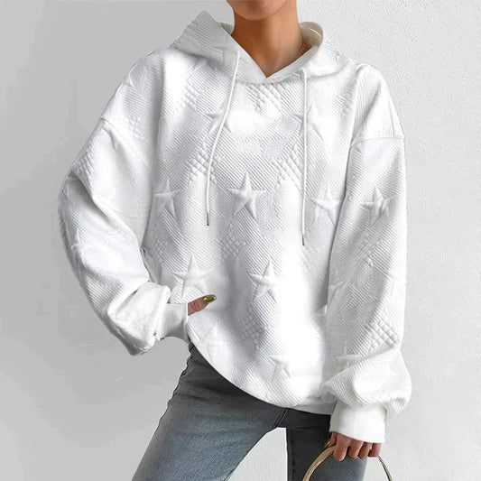 Women's black zip-up relaxed fit hoodie with embossed star pattern, front view, for casual comfort.