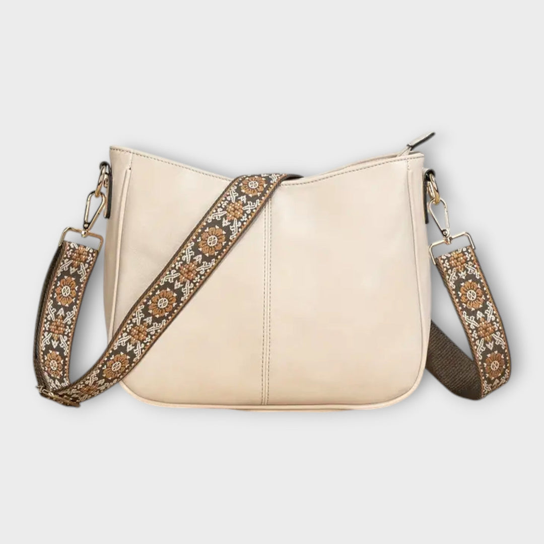 Fashionable bohemian shoulder bag for women, showcasing delicate beading and a comfortable wide strap.